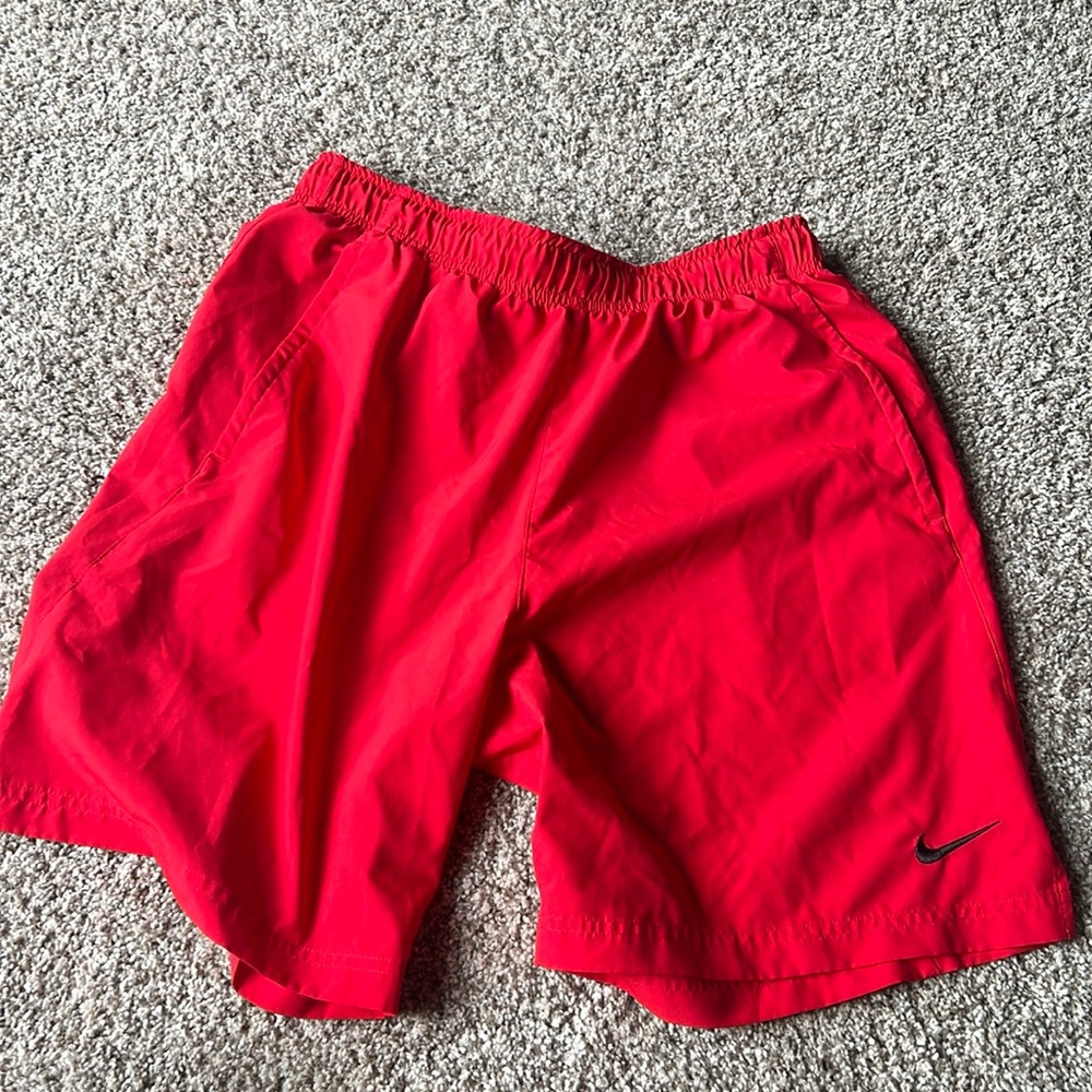 Men’s red Nike athletic shorts